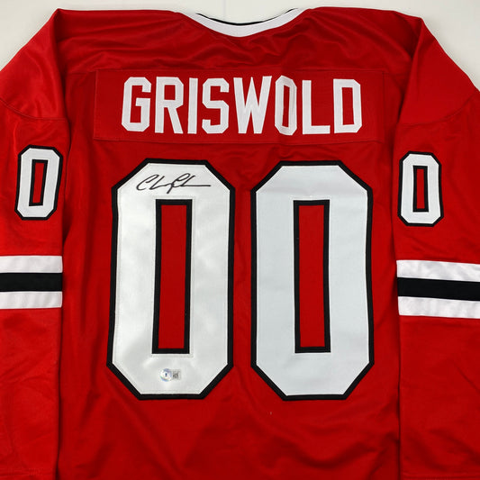 Autographed/Signed Chevy Chase Clark Griswold Christmas Vacation Movie Chicago Red Hockey Jersey Beckett BAS COA