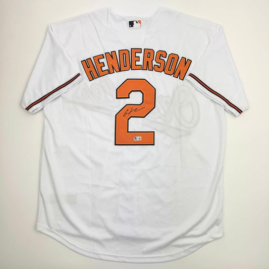 Autographed/Signed Gunnar Henderson Baltimore White Baseball Jersey Beckett BAS COA