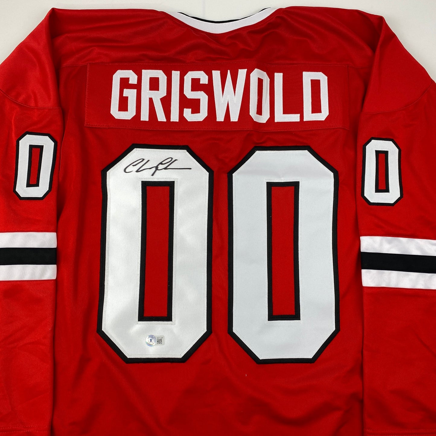 Autographed/Signed Chevy Chase Clark Griswold Christmas Vacation Movie Chicago Red Hockey Jersey Beckett BAS COA